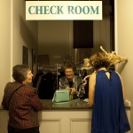 Judy Cooper mans the coat check, PhotoGALA at NOMA, Dec 10, 2009 (c) Samuel Portera