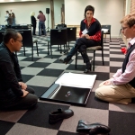 Sethasak Boonchai and Tim Best share work at PhotoNOLA portfilio review, 2009. (c) George Long
