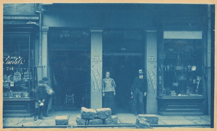 Bartel’s pet store and Weingart’s Office of the Southern Fireworks Manufactory, Decatur Street; ca. 1910; cyanotype by an unknown photographer; The Historic New Orleans Collection, gift of Audrey Moulin Stier, 2003.0167.2