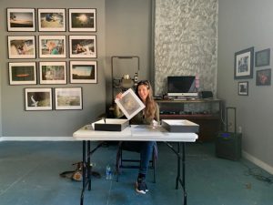 Natasha Sanchez signing Collectors Club prints at New Orleans Photo Alliance gallery